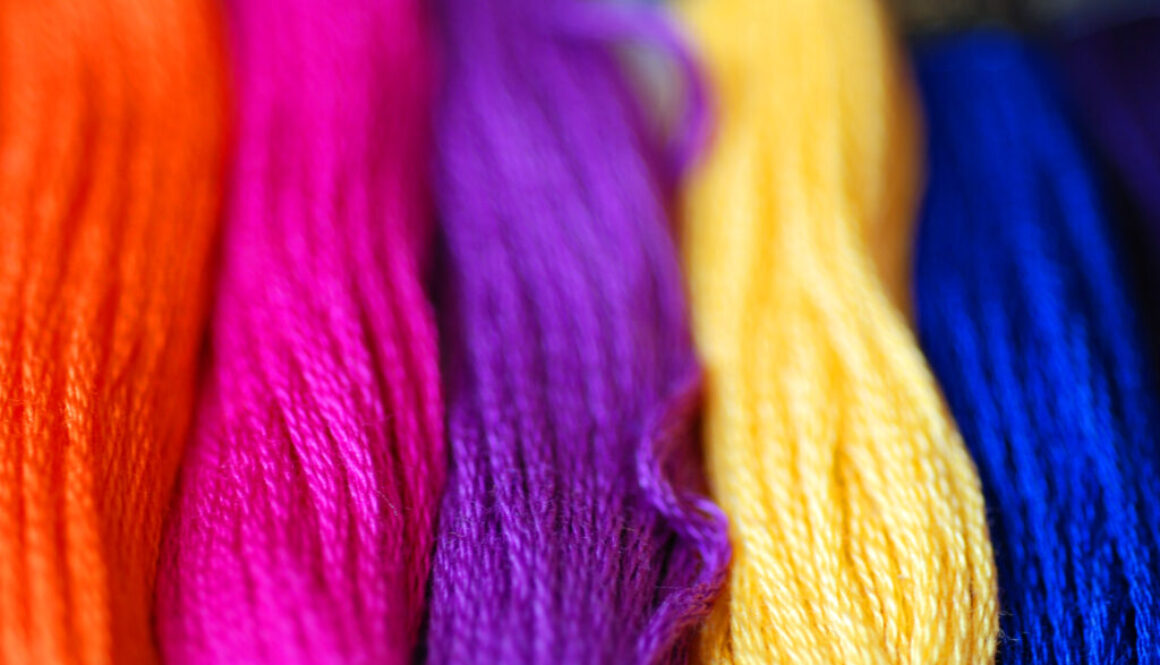 Coloured Thread A close-up of bright and colourful sewing threads,